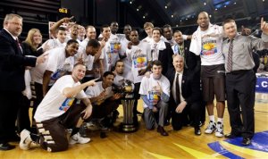 St. Bonaventure players and coaches pose for a photograph after defeating Xavier 67-56 to win the NCAA college basketball championship game in the Atlantic 10 men's tournament in Atlantic City, N.J., Sunday, March 11, 2012. (AP Photo/Mel Evans)